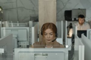 Woman with headset at computer recording calls - Automatically record every phone call with RECAP