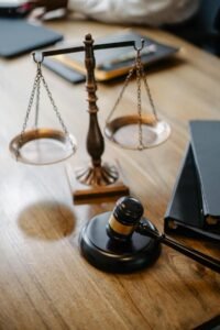 Gavel and scales of justice on wooden desk - Phone call recording laws guide