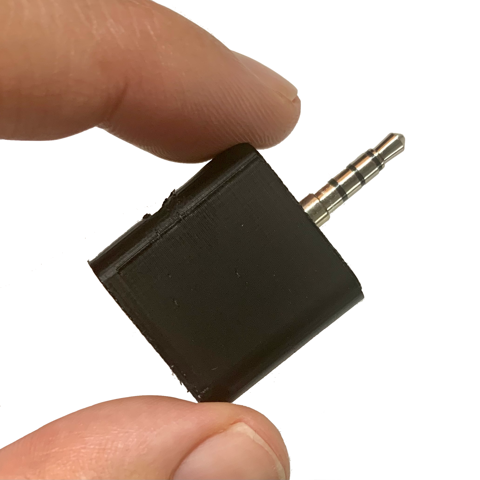 RECAP S2 call recording adapter held between two fingers